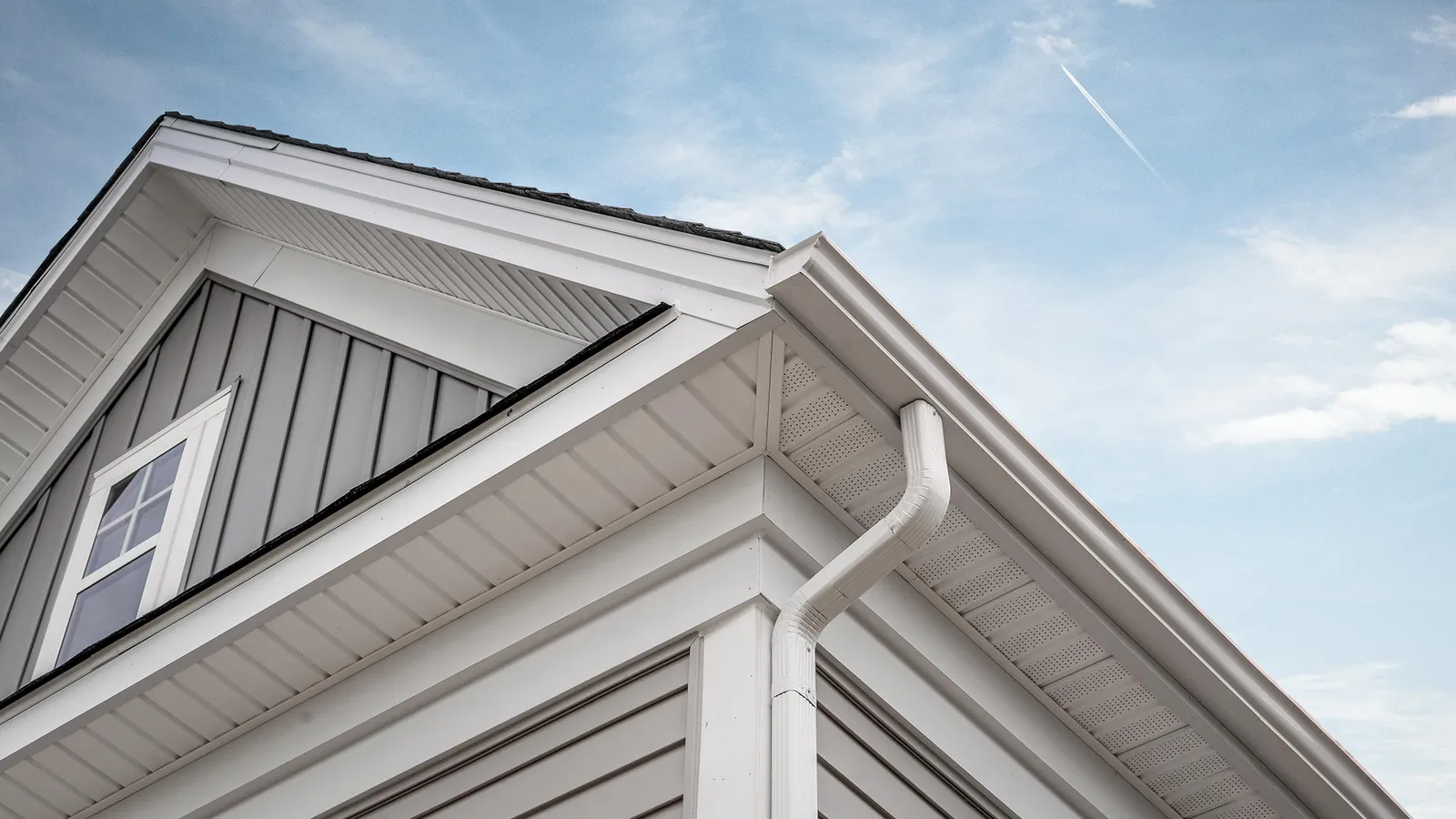 Crisp roofline with gutter and downspout — Ferrari Gutter Services, greater Akron area