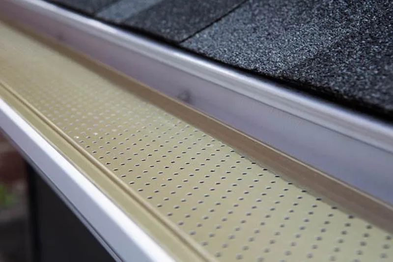 Alu-Rex perforated gutter guard keeping leaves out of the gutter
