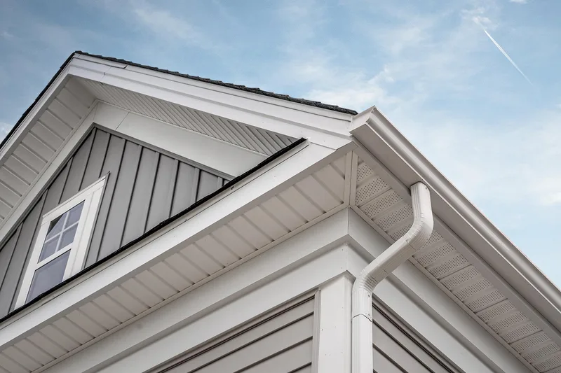 Roofline corner with gutter and downspout maintained by Ferrari Gutter Services
